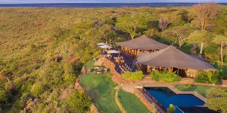 Aerial view of a luxury safari lodge in the wilderness